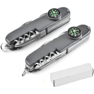 A multifunction knife in grey with a compass, featuring multiple tools and a keyring attachment, displayed with a box.