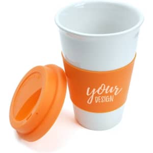 A ceramic mug in white with an orange silicone lid and sleeve, featuring a logo on the sleeve.