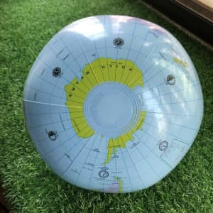 A customizable water ball features a blue globe design showcasing Antarctica, with a clear centre and a glossy surface.