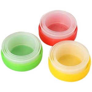 Three portable collapsible plastic cups in red, green, and yellow stacked together, featuring a logo on one cup.