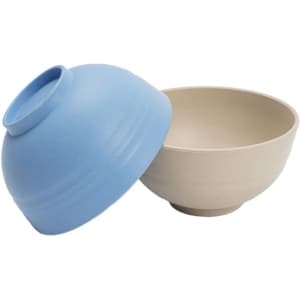 A light blue bowl with a smooth finish alongside a beige bowl, both made from wheat straw plastic.