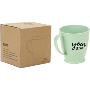 A green wheat straw plastic cup with a handle, displayed beside a cardboard box. The cup features a logo.