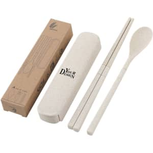 A wheat straw travel cutlery set in beige, featuring chopsticks and a spoon, packaged in a matching case with branding.