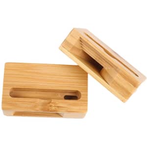 A wooden phone amplifier stand in a natural bamboo finish, featuring a slot for holding a phone securely.