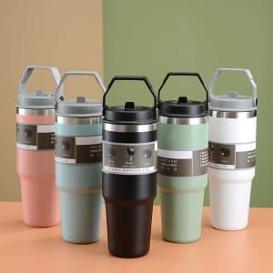 A drink bottle set featuring five insulated tumblers in pink, black, green, and white, each with a handle and logo.