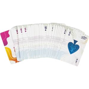 A fan of playing cards with a mix of coloured designs, featuring a prominent blue heart on the Ace card.