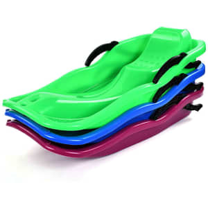 A set of four plastic snow sliders in green, blue, and purple, stacked with black handles.