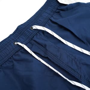 Navy blue men's quick dry beach shorts featuring an elastic waistband and white drawstrings, with a brand logo.
