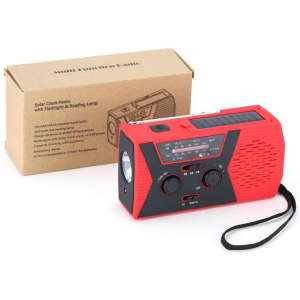 A red and black portable radio with flashlight and solar panel, alongside a brown packaging box.
