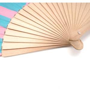 A wooden folding fan with a pink and blue patterned fabric, featuring a detailed wooden handle.