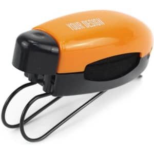 An orange and black sunglass visor clip with a logo, designed for attaching sunglasses in a car.