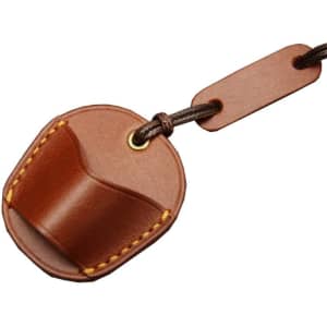 A brown leather glasses neck holder with a strap, featuring stitching and a branding logo.