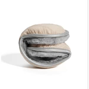A foldable down ear warmer in beige with grey lining, featuring a quilted design and a soft interior.