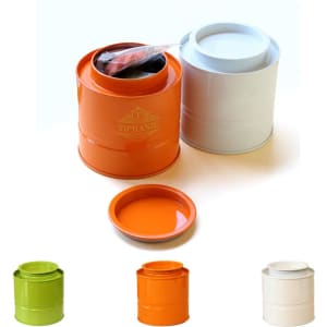 A set of cylindrical tin tea canisters in orange, green, and white, featuring matching lids and a logo.