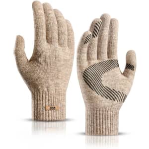 A pair of beige knitted gloves with a grip design on the palms and a tag featuring a logo.