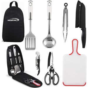 A camping cooking utensils set featuring stainless steel tools, including a spatula, ladle, tongs, knives, and a chopping board.
