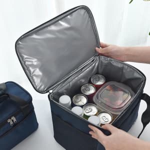 A navy insulated cooler lunch bag with cans and a container inside, featuring a silver interior lining.