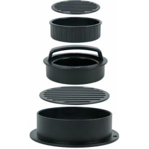 A black round burger patty maker with multiple detachable components for shaping and grilling patties.