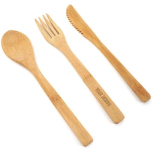 A bamboo cutlery set featuring a spoon, fork, and knife, all in natural bamboo colour with a logo.
