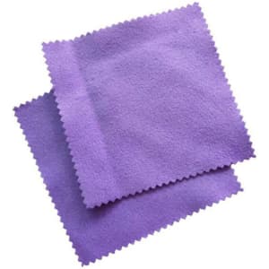 Two purple jewellery polishing cloths with a textured finish and scalloped edges.