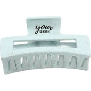 A greenish-blue wheat straw hair claw clip with a textured surface and a logo.