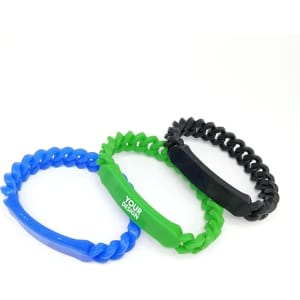 Three silicone twist bracelets in blue, green, and black, featuring a logo on one of the green bracelets.
