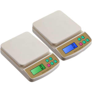 Two mini electronic kitchen scales in beige and gold, featuring digital displays and buttons in various colours.