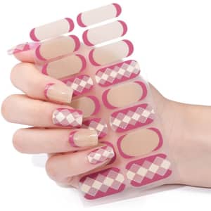 Custom nail art stickers in pink and nude tones, featuring a diamond pattern, displayed on a hand with manicured nails.