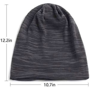 A slouchy cap in dark grey with a breathable stretch fabric, featuring a branded logo. Dimensions are 12.2 inches by 10.7 inches.