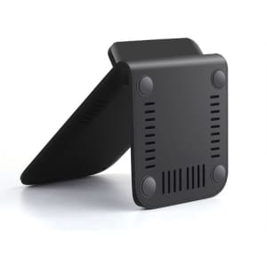 A black wireless charging stand with a minimalistic design, featuring textured grips on the bottom and a slanted support.