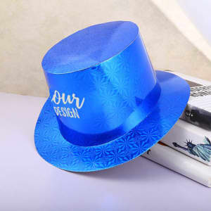 A blue paper top hat with a shiny surface and a decorative pattern, resting on books. It features a branding element.