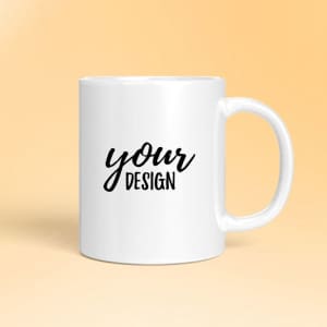A white ceramic mug with a black design area and a handle, featuring the phrase “your design.”