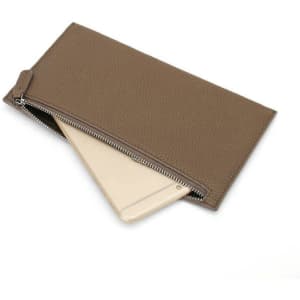 A long zipper wallet in a brown hue, featuring a textured finish and a smartphone partially visible inside.