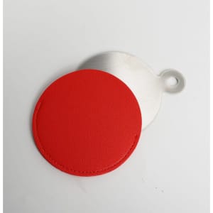 A red PU leather cosmetic mirror with a metal backing, featuring a loop for easy handling.