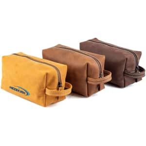 Three PU leather cosmetic bags in yellow, brown, and dark brown, each featuring a zip closure and a handle.