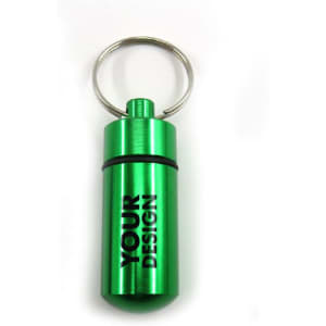 A green aluminium pill box keychain with a silver keyring, featuring a branding logo.