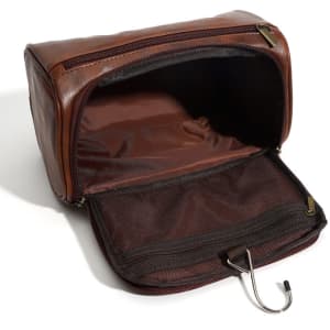 A brown PU leather toiletry bag with multiple compartments and a hook, featuring a zipper closure.