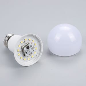 A 7W Smart LED light bulb in white, featuring a detachable dome cover and an exposed LED array inside.
