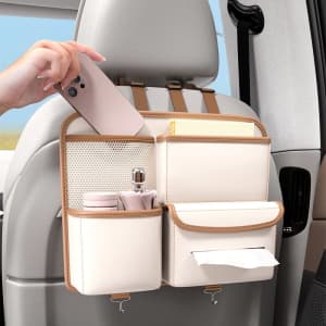 A cream and tan back seat storage bag featuring multiple pockets for organising items like a phone, drink, and wipes.