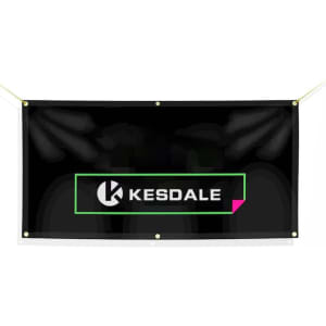 A black custom fence banner featuring a logo and text in green and white. It has eyelets for hanging.