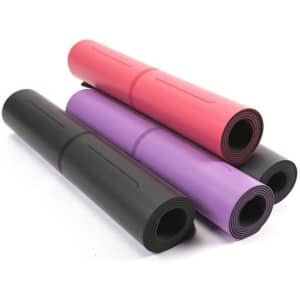 Four rolled yoga mats in black, pink, and purple, showcasing varying colours and textures. The mats feature a logo.