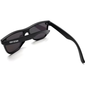A pair of black sports cycling sunglasses with dark lenses and a logo on the arm.