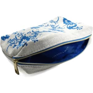 A blue and white custom jacquard embroidery bag with a zip closure and a patterned exterior.