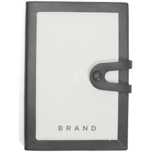 A softcover PU leather journal notebook in black and white, featuring a button closure and a logo on the front.
