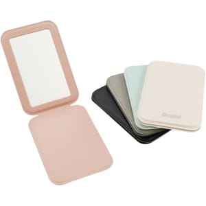 A PU folding makeup mirror in pastel colours, including pink, green, grey, black, and cream, with a logo.