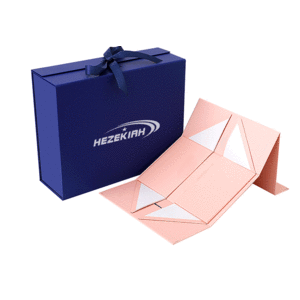 A collapsible gift packaging box in navy blue and pink, featuring a logo and a ribbon.