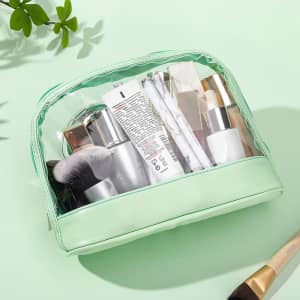 A portable clear toiletry bag in mint green, filled with various skincare and beauty products, including a makeup brush.