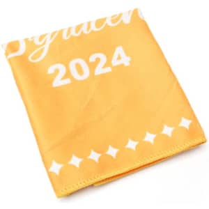 A yellow microfiber towel featuring a decorative pattern and a branding logo, folded neatly.