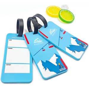Three soft PVC luggage tags in blue with a mountain and ski lift design, featuring a black strap and space for personal details.