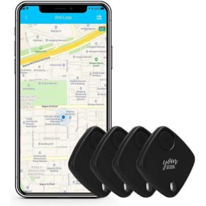 A smartphone displaying a map alongside four black smart key finders. The product features a logo on one finder.